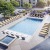 Albuquerque Apartments - Resort-Style Pool With Hot Tub, Sundeck, Lounge Chairs, Grills, And Potted Plants.
